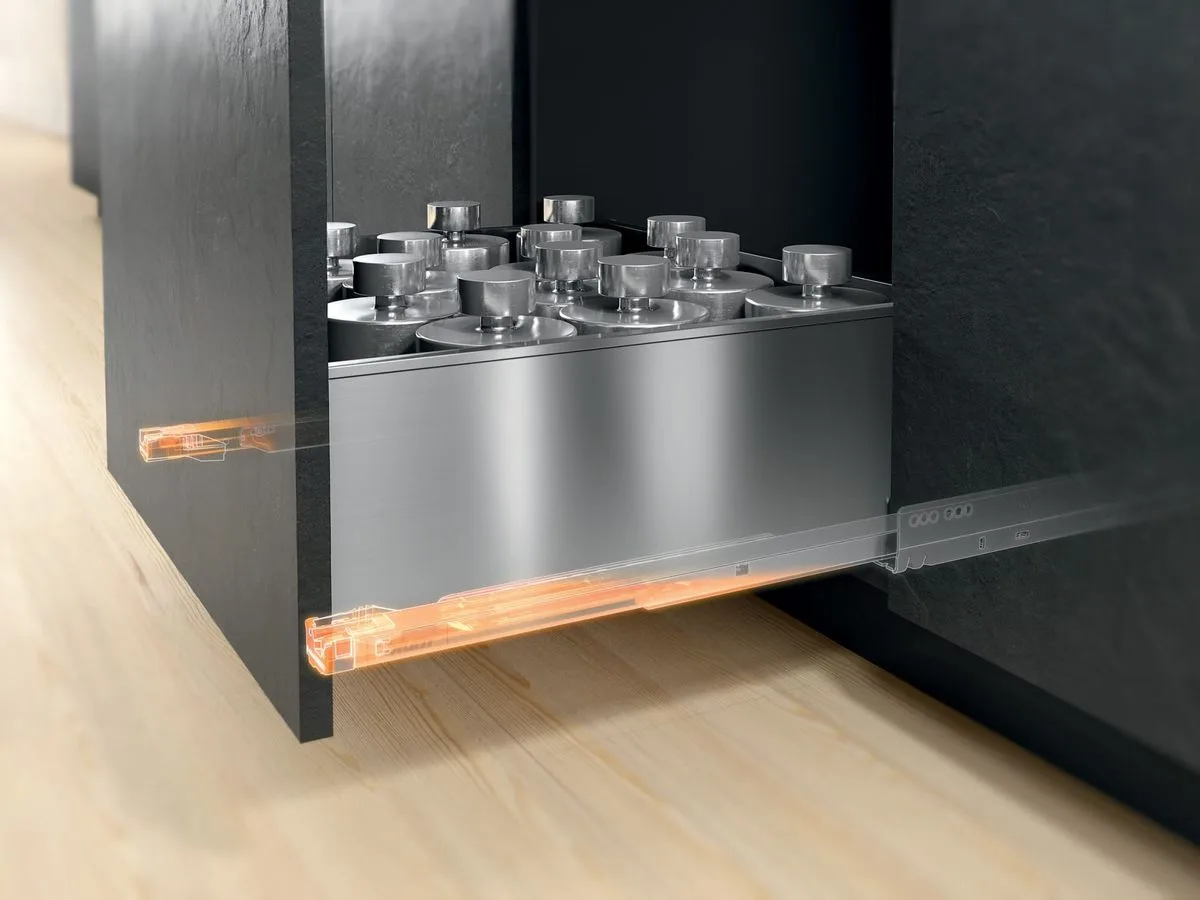Blum LEGRABOX pot drawer fully extended with heavy cookware, runners highlighted